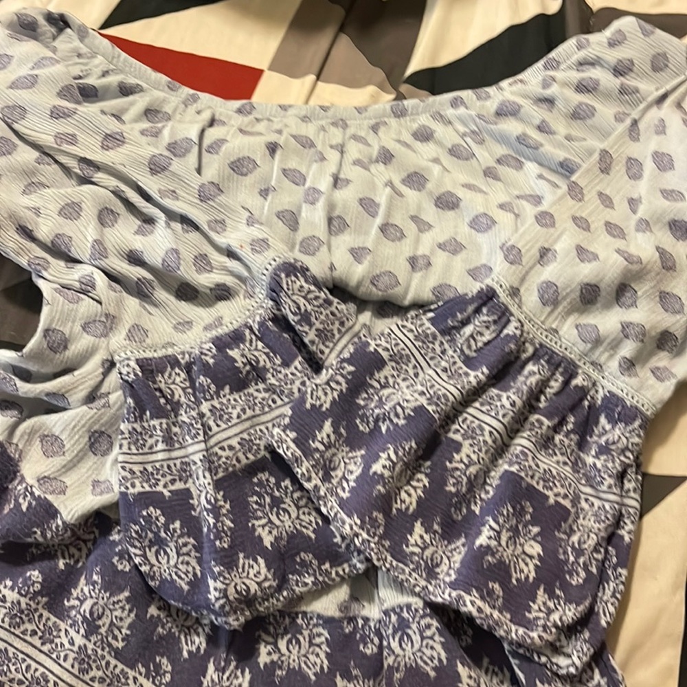 Blue romper patterned in size XS barley worn like new